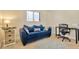 Small home office with blue couch and work area at 813 Bahia Del Sol Dr # 33, Ruskin, FL 33570