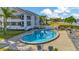 Inviting kidney-shaped pool with lounge chairs at 813 Bahia Del Sol Dr # 33, Ruskin, FL 33570