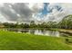 Peaceful pond view with lush green landscaping at 8186 Terrace Garden N Dr # 604, St Petersburg, FL 33709