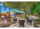 Relaxing patio furniture under shady trees in a spacious backyard at 8296 15Th N Way, St Petersburg, FL 33702