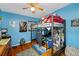 Bedroom with a loft bed, desk, and hardwood floors at 8296 15Th N Way, St Petersburg, FL 33702