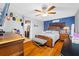 Main bedroom with a ceiling fan and hardwood floors at 8296 15Th N Way, St Petersburg, FL 33702