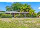 Charming brick home with palm trees and a spacious lawn at 8296 15Th N Way, St Petersburg, FL 33702