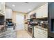 Well-equipped kitchen with stainless steel appliances and white cabinets at 8296 15Th N Way, St Petersburg, FL 33702