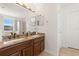 Double vanity bathroom with granite countertop at 8919 N River Rd, Tampa, FL 33635