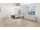 Bedroom with wood-look floors and plenty of natural light at 8919 N River Rd, Tampa, FL 33635