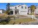 Two-story house with a large driveway and landscaping at 8919 N River Rd, Tampa, FL 33635