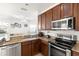 Modern kitchen with stainless steel appliances and granite countertops at 8919 N River Rd, Tampa, FL 33635