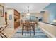 Light-filled dining area with seating for four and kitchen access at 90 S Highland Ave # 12, Tarpon Springs, FL 34689