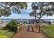 Wooden walkway leading to a waterfront dock at 90 S Highland Ave # 12, Tarpon Springs, FL 34689