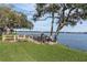 Lakeside deck with picnic tables and grills at 90 S Highland Ave # 12, Tarpon Springs, FL 34689