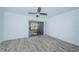 Bright bedroom with ceiling fan and sliding glass doors at 9209 Seminole Blvd # 138, Seminole, FL 33772