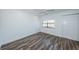 Spacious bedroom with wood-look floors and ceiling fan at 9209 Seminole Blvd # 138, Seminole, FL 33772