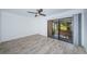 Bedroom with sliding doors to a private patio at 9209 Seminole Blvd # 138, Seminole, FL 33772