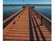 Long wooden dock extending into the lake at 9209 Seminole Blvd # 138, Seminole, FL 33772