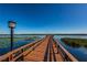 Wooden dock on calm lake with lily pads at 9209 Seminole Blvd # 138, Seminole, FL 33772