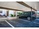 Covered parking carport for one vehicle with additional parking nearby at 9209 Seminole Blvd # 138, Seminole, FL 33772