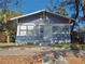 Front view of a charming gray house with white trim at 1004 E 22Nd Ave, Tampa, FL 33605