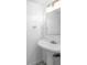 Simple bathroom with pedestal sink and mirror at 10061 Lake Oak Cir, Tampa, FL 33624