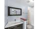 Updated bathroom with dark vanity and walk-in shower at 10061 Lake Oak Cir, Tampa, FL 33624