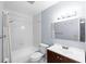 Clean bathroom with tub, shower, and vanity at 10061 Lake Oak Cir, Tampa, FL 33624