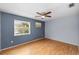 Bright bedroom with wood floors and ceiling fan at 10061 Lake Oak Cir, Tampa, FL 33624