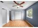 Spacious bedroom featuring wood floors and ample closet space at 10061 Lake Oak Cir, Tampa, FL 33624
