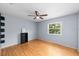 Charming bedroom with wood floors and built-in shelving at 10061 Lake Oak Cir, Tampa, FL 33624