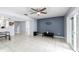 Living area with tiled floor and access to kitchen at 10061 Lake Oak Cir, Tampa, FL 33624