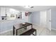 Living room with tiled floors and access to kitchen at 10061 Lake Oak Cir, Tampa, FL 33624