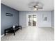 Living room with tiled floors and access to patio at 10061 Lake Oak Cir, Tampa, FL 33624