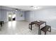 Living room with tiled floor and patio access at 10061 Lake Oak Cir, Tampa, FL 33624