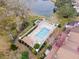 Community pool with lounge chairs and surrounding landscaping at 10061 Lake Oak Cir, Tampa, FL 33624