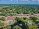 Aerial view showing community amenities including tennis courts and pools at 10330 Carrollwood Ln # 93, Tampa, FL 33618