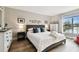 Large main bedroom with a king-size bed and water views at 10330 Carrollwood Ln # 93, Tampa, FL 33618