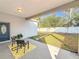 Private backyard with covered patio and small seating area at 1103 S Prospect Ave, Clearwater, FL 33756