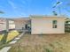 House exterior showcasing backyard, patio, and landscaping at 1103 S Prospect Ave, Clearwater, FL 33756