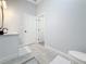 Bathroom with toilet and access to another room at 1103 S Prospect Ave, Clearwater, FL 33756