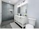 Modern bathroom with gray tile shower and double vanity at 1103 S Prospect Ave, Clearwater, FL 33756