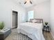 Bedroom with a queen bed, closet, and side table at 1103 S Prospect Ave, Clearwater, FL 33756