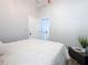 Bright bedroom with a comfortable bed and modern decor at 1103 S Prospect Ave, Clearwater, FL 33756