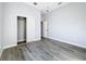 Light bedroom featuring wood-look floors and a large closet at 1103 S Prospect Ave, Clearwater, FL 33756