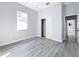 Bright bedroom with wood-look floors, and spacious closet at 1103 S Prospect Ave, Clearwater, FL 33756