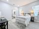 Spacious bedroom with gray bedding and en-suite bathroom at 1103 S Prospect Ave, Clearwater, FL 33756