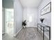 Bright entryway with glass door and console table at 1103 S Prospect Ave, Clearwater, FL 33756