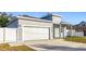 Gray house with white garage door and fence at 1103 S Prospect Ave, Clearwater, FL 33756