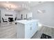 White kitchen island with quartz countertop, overlooks dining area at 1103 S Prospect Ave, Clearwater, FL 33756