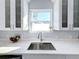 Modern kitchen with stainless steel appliances and white shaker cabinets at 1103 S Prospect Ave, Clearwater, FL 33756
