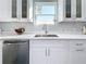 Modern kitchen with stainless steel appliances and white shaker cabinets at 1103 S Prospect Ave, Clearwater, FL 33756