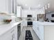 Modern kitchen featuring white cabinets and stainless steel appliances at 1103 S Prospect Ave, Clearwater, FL 33756